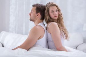 Couple with marital problems sitting back to back